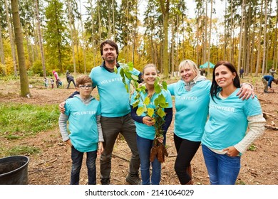 Happy Family With Children As An Environmentalist Team At An Ecological Reforestation