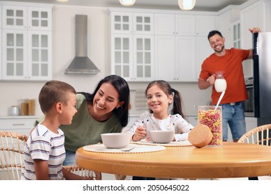 Happy Family With Children Having Fun During Breakfast At Home