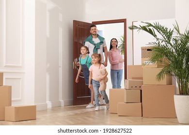 Happy Family With Children Moving Into New House