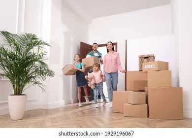Happy family with children moving into new house