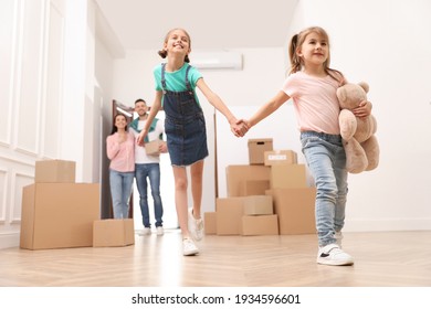 Happy Family With Children Moving Into New House, Low Angle View