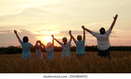 Happy family with children raising hands in wheat field. Parents kids together raising hands at sunset, teamwork family business. Family prayer in nature, religion. Parents children big family outdoor - Powered by Shutterstock