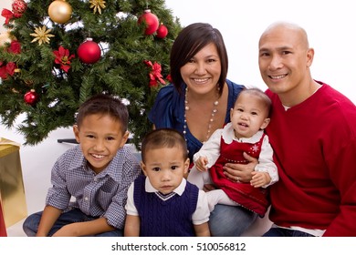 Happy Family At Christmas Isolated On White.