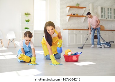 Happy family cleans the room in the house. - Powered by Shutterstock