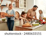 A happy family is cooking together in a bright kitchen, showing joy, teamwork, and love for homecooked meals, creating a warm and loving atmosphere at home