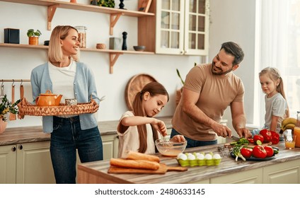 A happy family is cooking together in a bright kitchen, showing joy, teamwork, and love for homecooked meals, creating a warm and loving atmosphere at home - Powered by Shutterstock