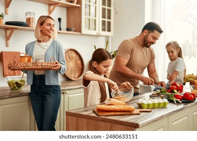 A happy family is cooking together in a bright kitchen, showing joy, teamwork, and love for homecooked meals, creating a warm and loving atmosphere at home - Powered by Shutterstock