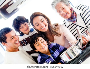 Happy Family Cooking Together At Home And Smiling