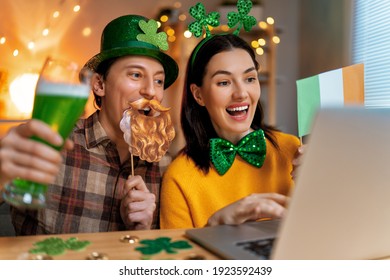 Happy family couple celebrating St. Patrick's Day with their friends by online at home. - Powered by Shutterstock