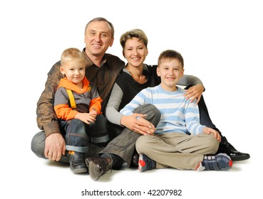 Happy Family. The Daddy, Mum, Two Sons. It Is Isolated On A White Background.