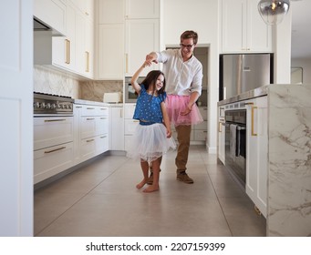 Happy Family, Dance And Kitchen With Father And Daughter Having Fun, Playing And Enjoy Freedom At Home. Creative Parent Dressing Up And Dancing To Support And Encourage His Daughter Ballet Hobby