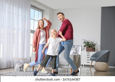 Happy Family Dancing At Home