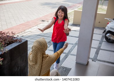 Happy Family Daughter Running And Hugging Mum After Going Back From School