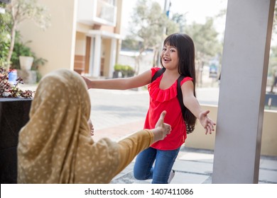 Happy Family Daughter Running And Hugging Mum After Going Back From School