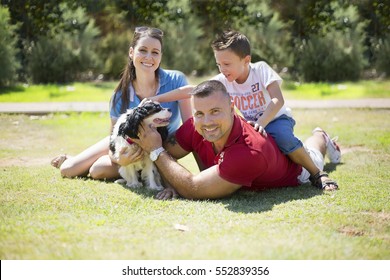 Happy Family With A Dog