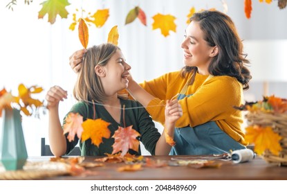 Happy Family Doing Autumn Decor. Fall Atmosphere