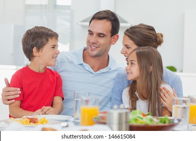 Happy Family During The Dinner At Home At The Table