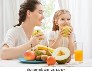 Happy Family Eating Fresh Fruit