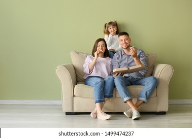 Happy Family Eating Pizza At Home