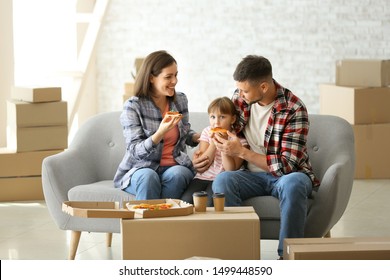 Happy Family Eating Pizza On Moving Day