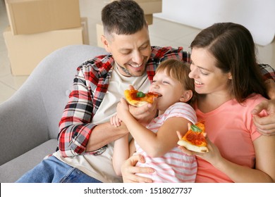 Happy Family Eating Pizza On Moving Day