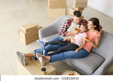 Happy Family Eating Pizza On Moving Day