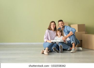 Happy Family Eating Pizza On Moving Day