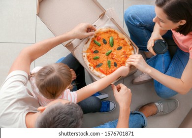 Happy Family Eating Pizza On Moving Day