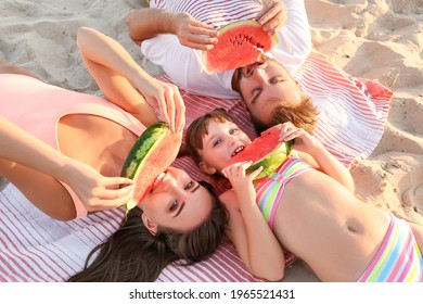 Happy Family Eating Watermelon On Sea Beach