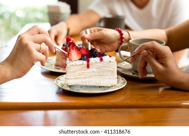 Happy family enjoy eating cake in the restaurant. indoor - Powered by Shutterstock