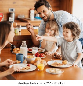 Happy family enjoying breakfast together in cozy kitchen - Powered by Shutterstock