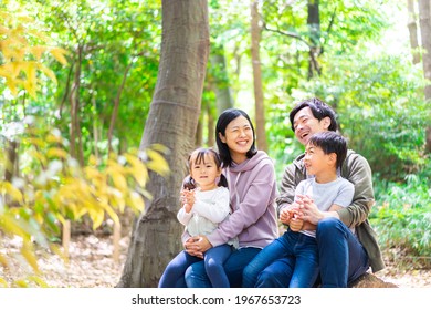 Happy Family Enjoying A Hike In The Mountains