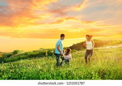 Happy Family Enjoying The Life Together Outdoors