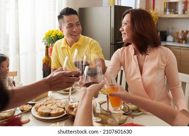 Happy Family Enjoying Lunar New Year Celebration Dinner At Home