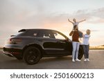 Happy family enjoying road trip. Parents and daughter near car