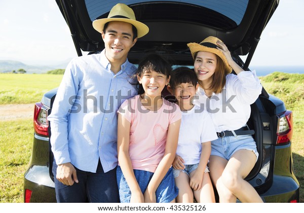 happy\
family enjoying road trip and summer\
vacation