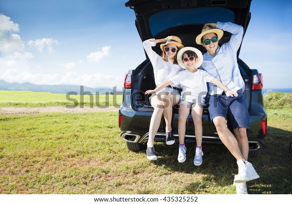 happy\
family enjoying road trip and summer\
vacation