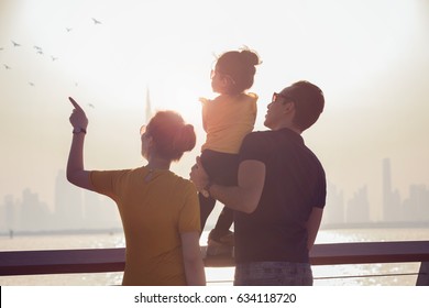 Happy Family Enjoying Sunrise In Dubai 