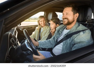 Happy family enjoying trip together by car, view from outside - Powered by Shutterstock