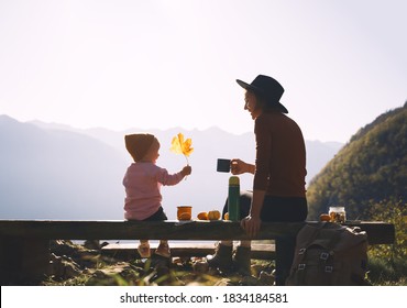 Happy Family Enjoying Vacations In Autumn Time. Mother And Daughter On A Picnic In Mountains. Mom And Little Child Girl Relaxing Outdoors. Adventure Travel With Kids, Camping And Hiking In Nature.