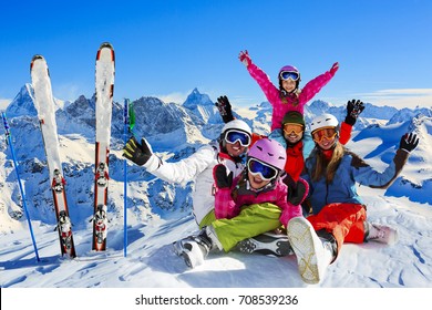 Happy family enjoying winter vacations in mountains . Ski, Sun, Snow and fun. Composite photo, photo manipulation,  only 4 model releases needed. - Shutterstock ID 708539236