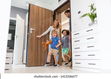 Happy Family Entering The House