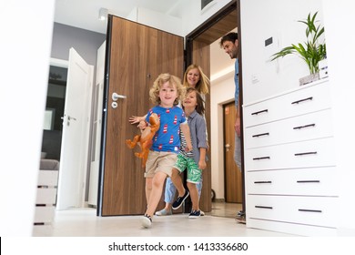 Happy Family Entering The House