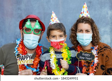 Happy Family With Face Masks Celebrating New Years Eve