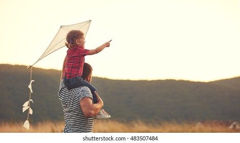 happy family father and child on meadow with a kite in the summer on the nature - Shutterstock ID 483507484