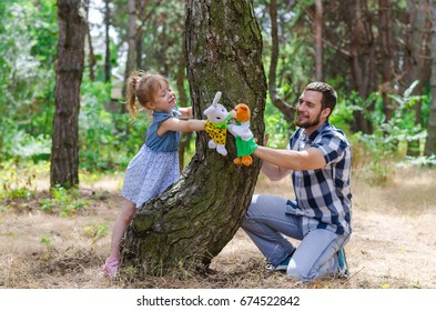 A happy family, father and daughter are playing in nature, a copy of the free space. Background Father's Day. - Shutterstock ID 674522842