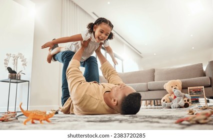 Happy family, father and girl playing in a house with freedom, bonding and enjoying quality time together. Happiness, smile and child flying in dads arms on the floor on a weekend at home in Portugal - Powered by Shutterstock