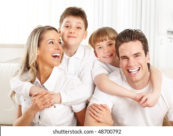 Happy family. Father, mother and children at home