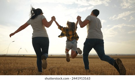 happy family. father mother and daughter together run throw up in park sunset silhouette. people in park. happy family and little baby child summer. kid dream concept. children fun run - Powered by Shutterstock