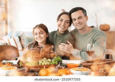 Happy family at festive table on Thanksgiving Day - Powered by Shutterstock